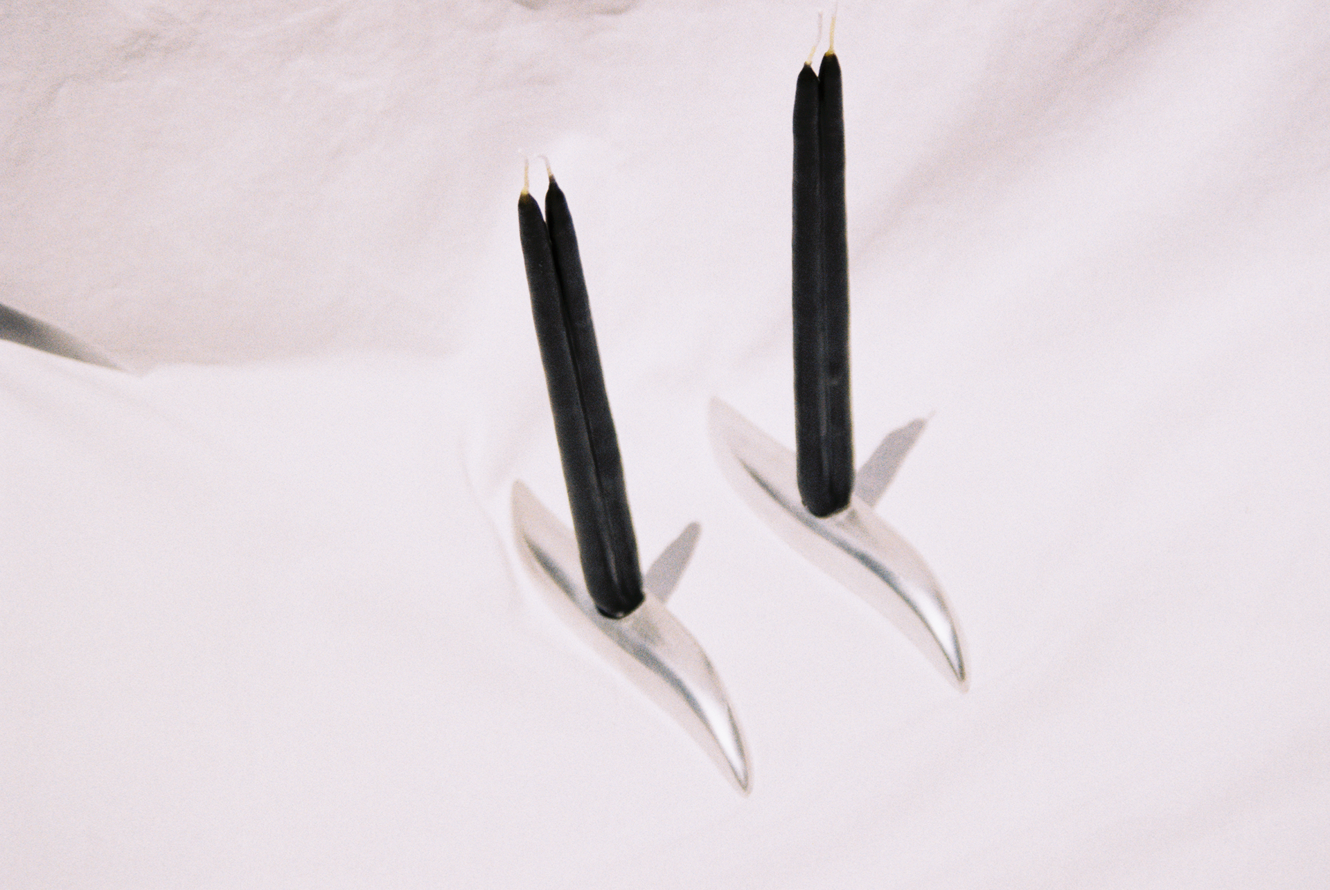 A.L. BASA charcoal-dipped conjoined tapers