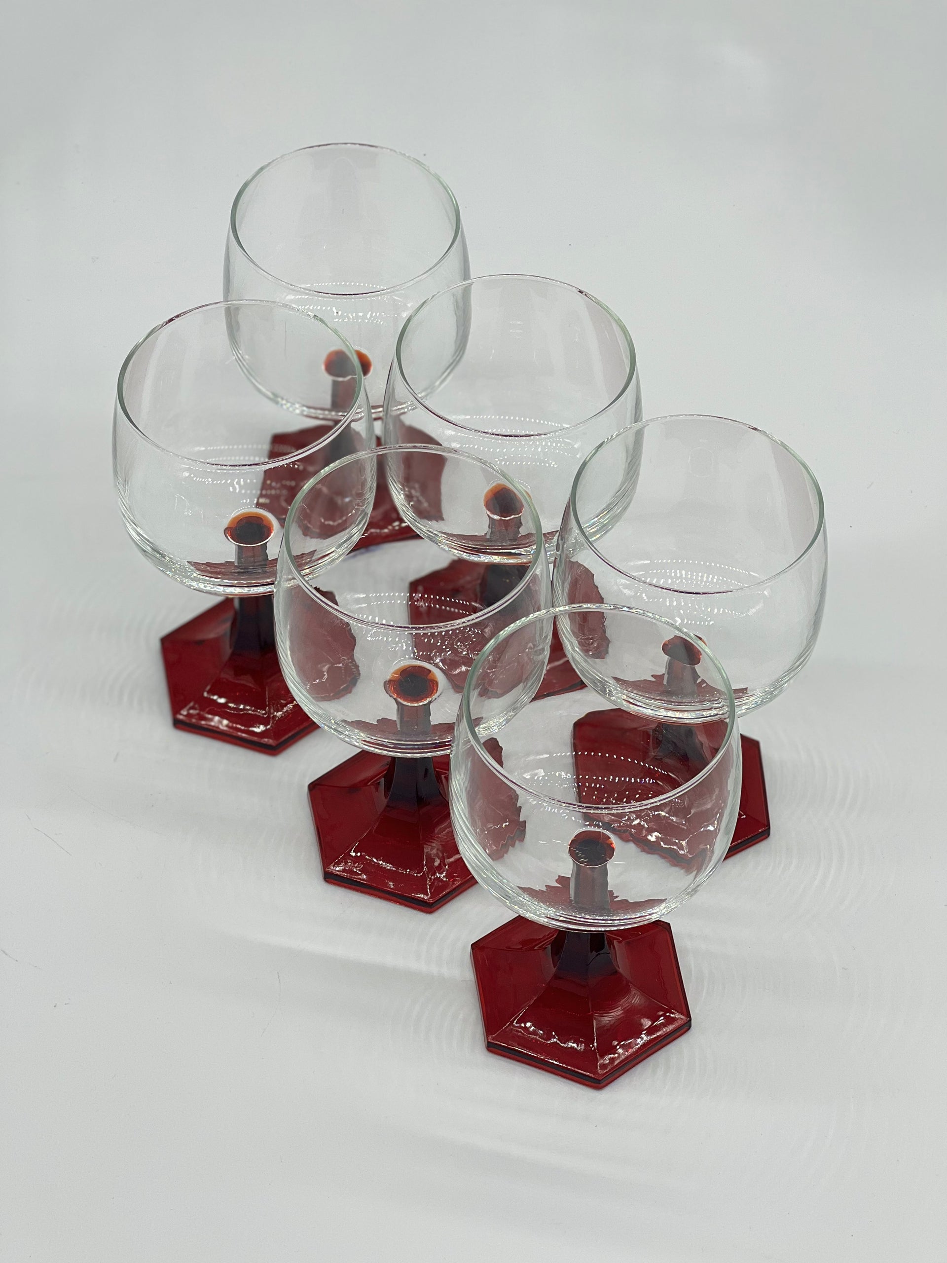 red stemmed wine glasses