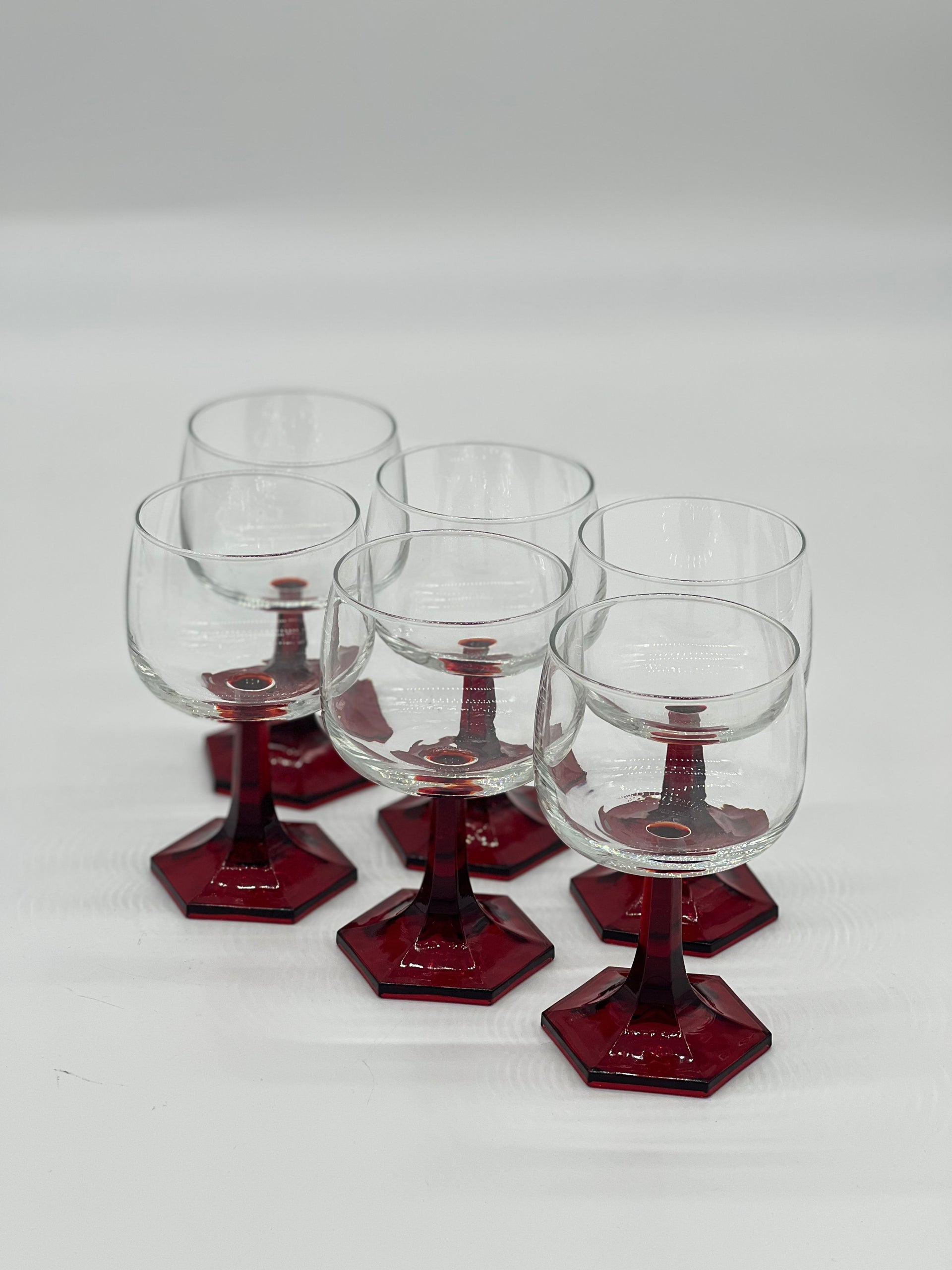 red stemmed wine glasses