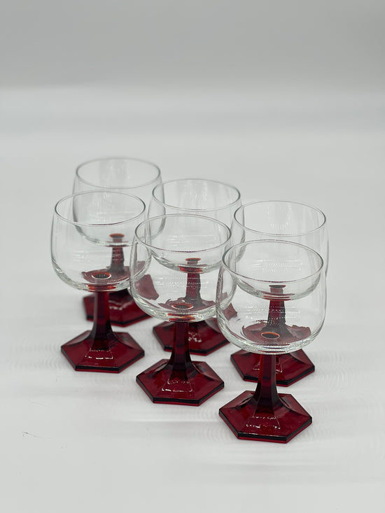 red stemmed wine glasses