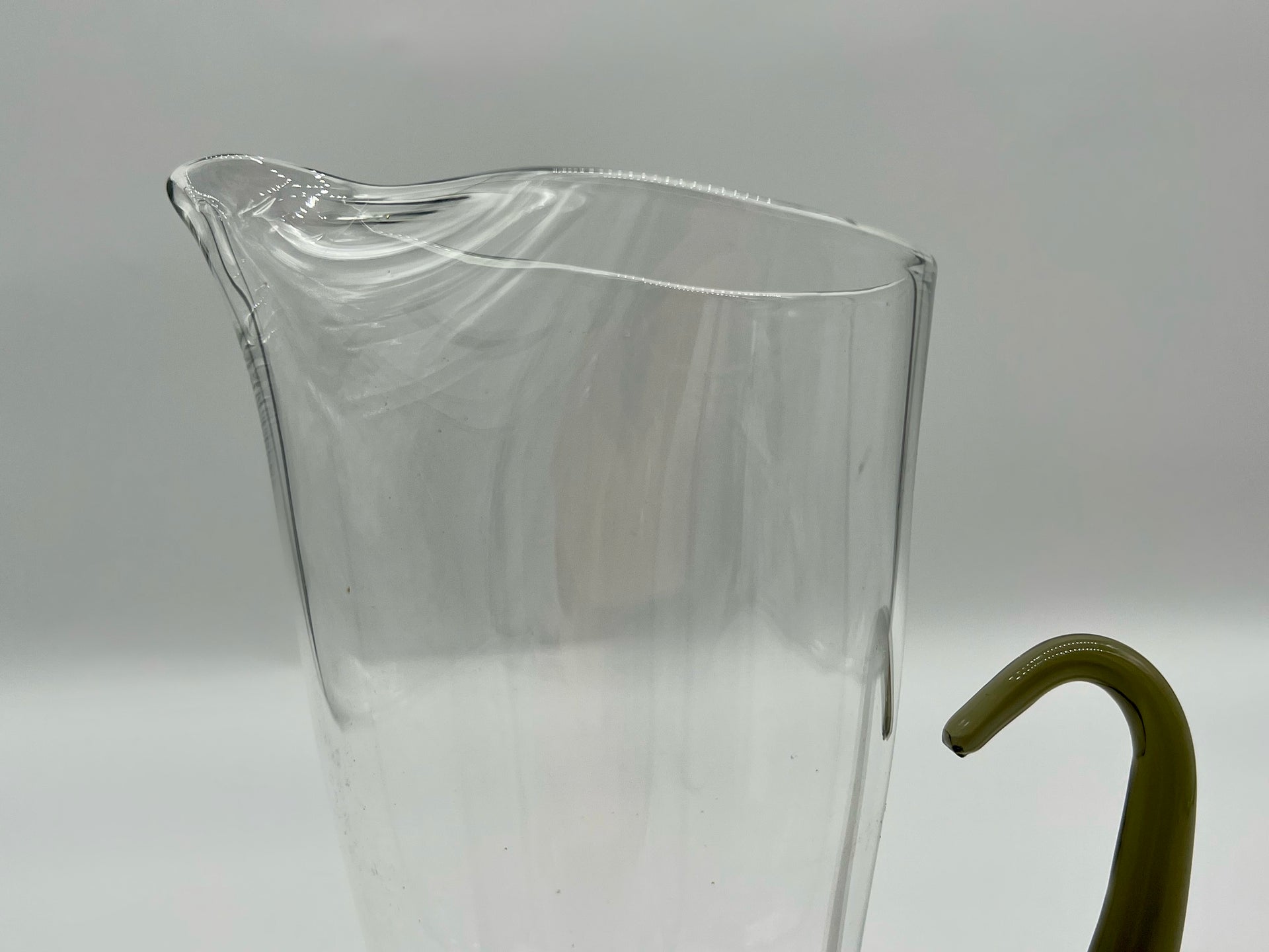 artisanal jug with smoked glass handle